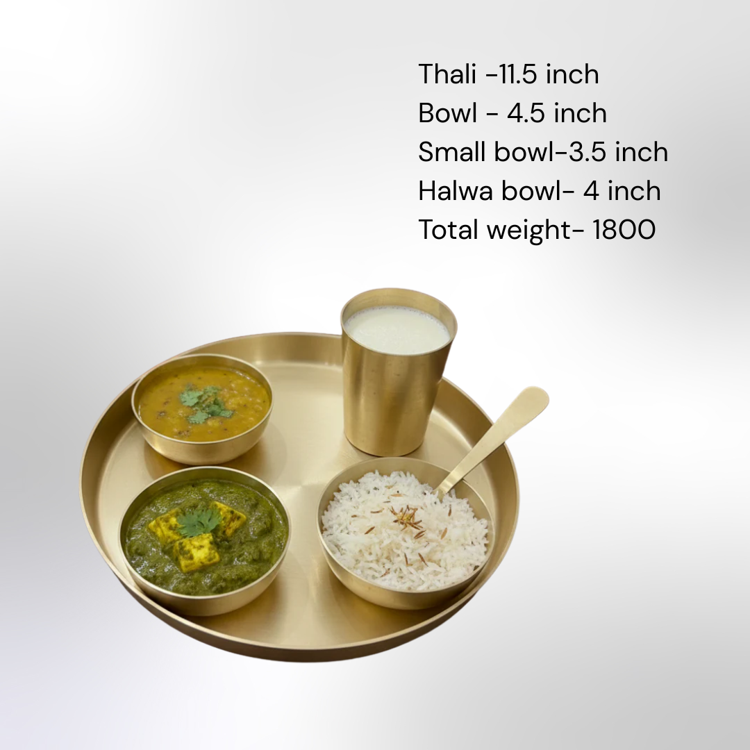 Kansa thali set includes plate, bowls, and glass